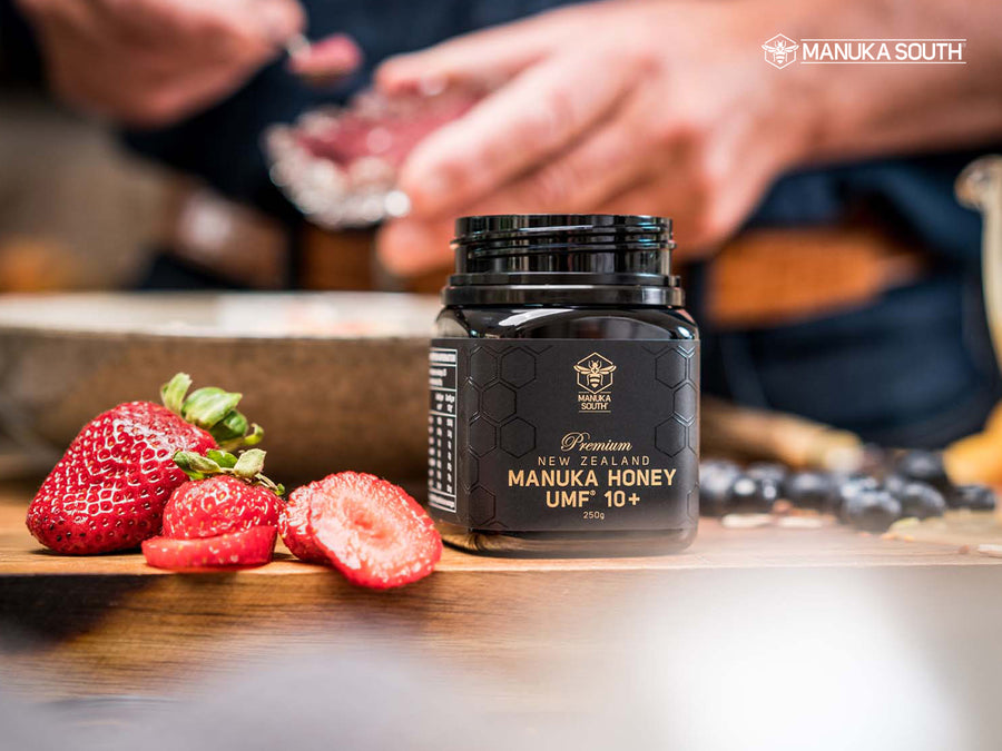 UMF 10+ manuka honey jar at breakfast preparation.