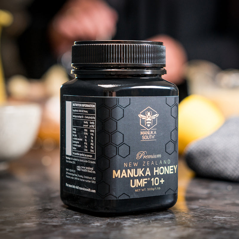 Angled close up of UMF 10+ Manuka Honey on table