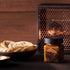 manuka honey on a table with pita bread beside it