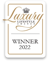 Luxury Lifestyle Awards 2022 winner badge with gold text and crown emblem.