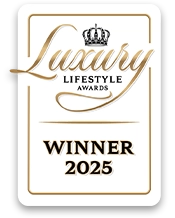 Award plaque for 'Luxury Lifestyle Awards Winner 2025' with gold text and a crown symbol.