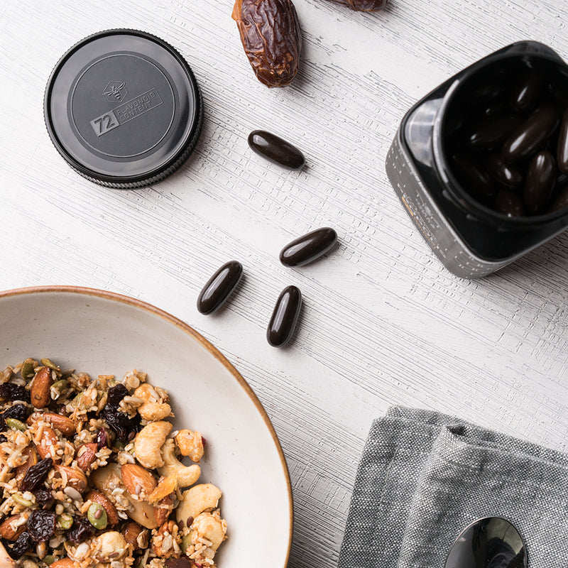 Black Reserve Propolis Capsules on table with cereal