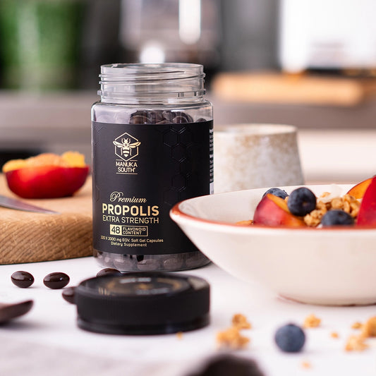 opened bottle of propolis on a table
