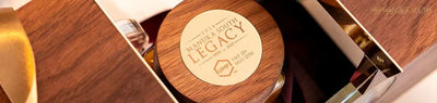 Luxury Manuka honey gift box with wooden lid and gold details.