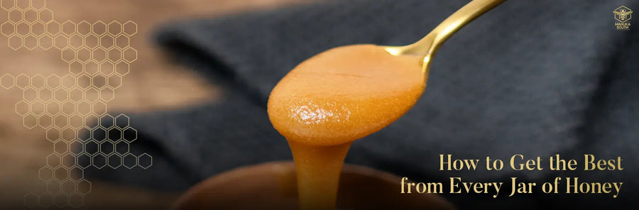 Spoon lifts thick Manuka honey from a jar with a soft cloth in the background, representing Best Manuka Honey.