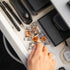 Hand reaching for manuka honey drops lozenges from a desk drawer