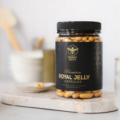 a bottle of royal jelly capsules on a table